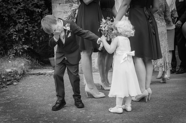 The flower girl and the page boy outside the church 