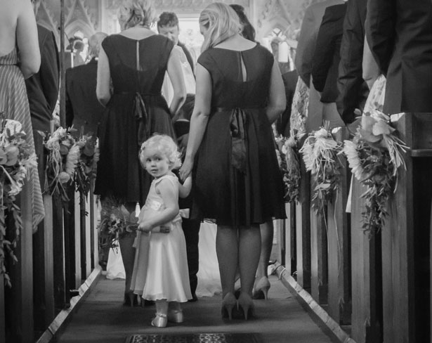 The bridesmaids with the flower girl in the church 