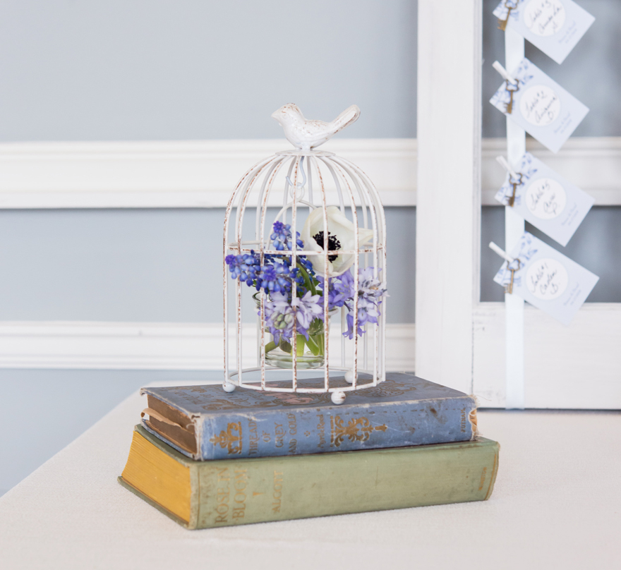 Vintage Blue Books and Floral Birdcage Wedding Theme | Confetti.co.uk