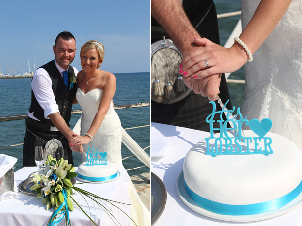 The happy couple cutting their wedding cake