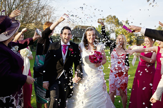 Guests throwing confetti to celebrate the marriage 