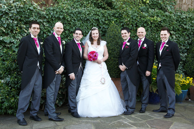 The newlyweds with their groomsmen 