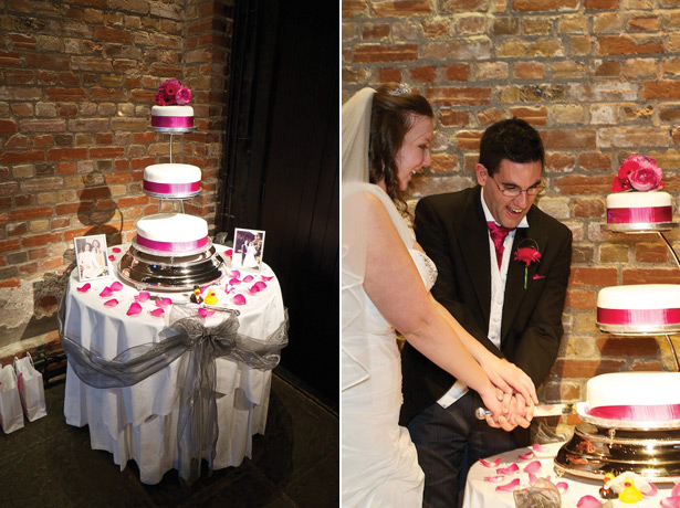 White wedding cake with fuchsia pink gerberas