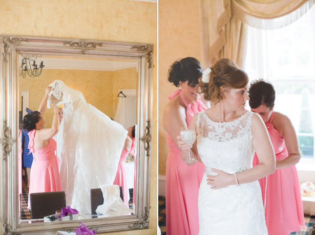 Bridesmaids helping the bride with her dress 