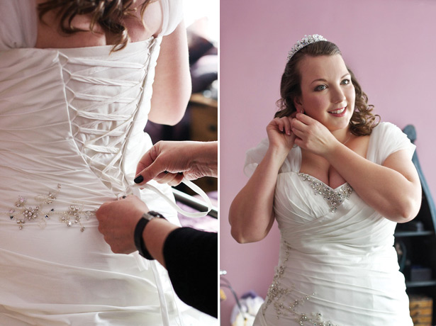 The bride in her wedding dress putting her accessories on