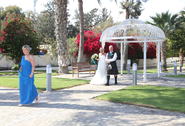 The brides with her father on their way to the ceremony  