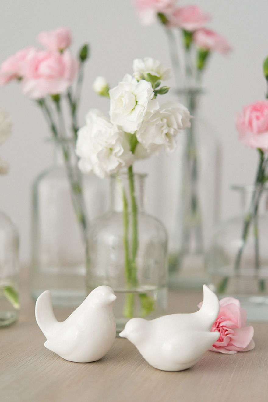 Pink and White Carnations in Glass Bottles Wedding Decor Flowers Centrepiece | Confetti.co.uk