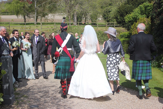 The bride and groom leaving the church