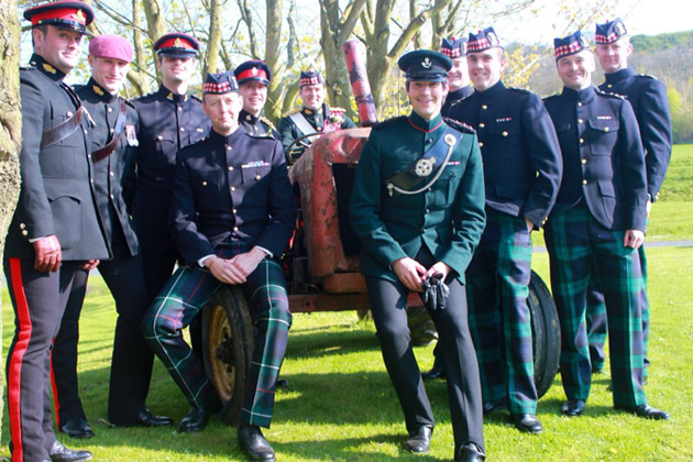 Groom in military uniform with his military comrades 