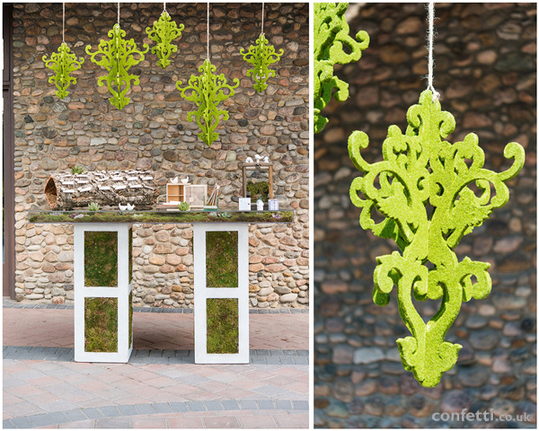 Woodland themed wedding table with moss chandeliers 