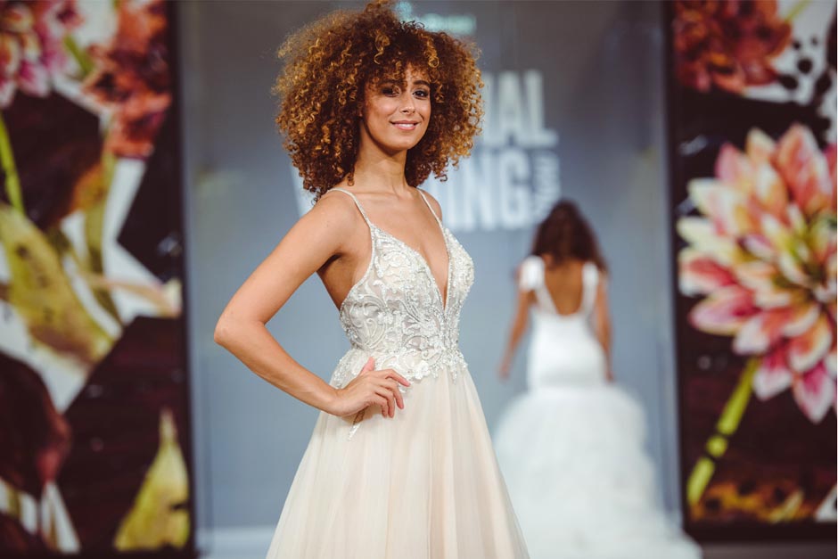 Bride wearing pink wedding dress on National Wedding Show catwalk