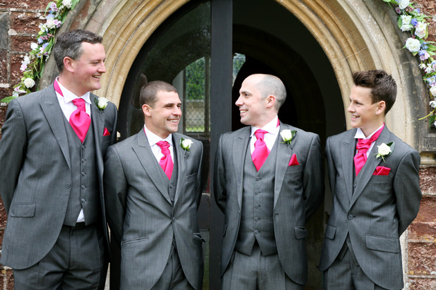 Groom and groomsmen in grey suits with hot pink cravat from Rossetti Brides| Confetti.co.uk