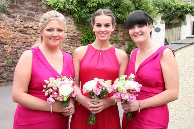 Bridesmaids in hot pink sleeveless satin dress from Alexon and from Coast| Confetti.co.uk