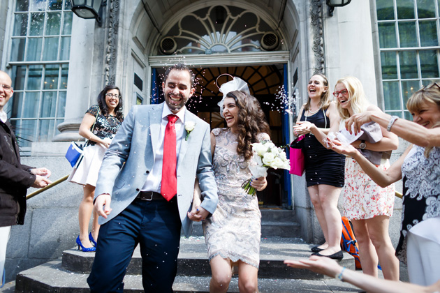 Guests throwing confetti to celebrate | Confetti.co.uk