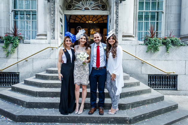 The newlyweds with their wedding guests| Confetti.co.uk