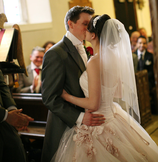 The first kiss as husband and wife | Confetti.co.uk