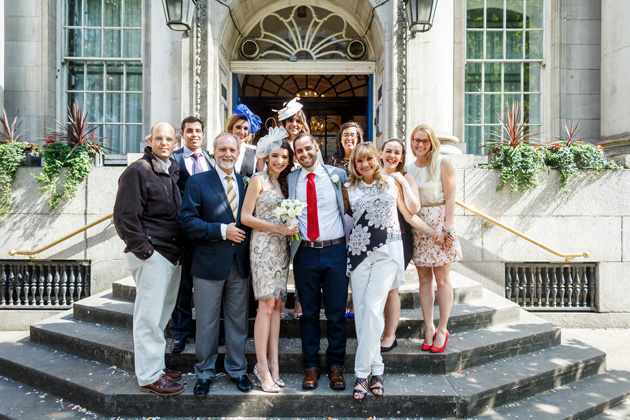 The newlyweds with their wedding guests| Confetti.co.uk