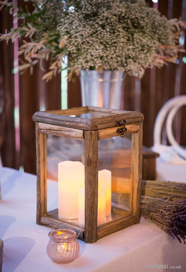 Woodland, nature inspired wedding centrepiece with pillar candles | Confetti.co.uk 