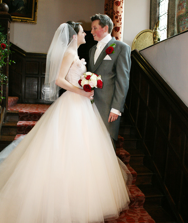 The bride in her blush pink gown and the groom in his grey suit by Ava Images | Confetti.co.uk