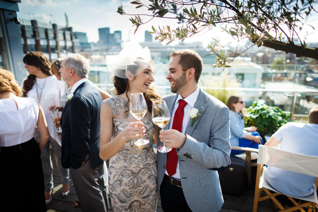 The newlyweds toasting their marriage| Confetti.co.uk