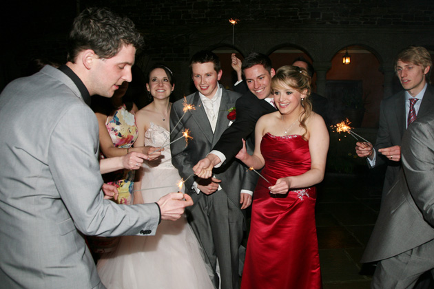 Guests lighting sparklers | Confetti.co.uk