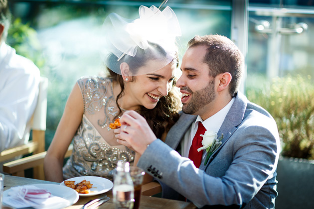 Bride and groom enjoying the wedding breakfast | Confetti.co.uk