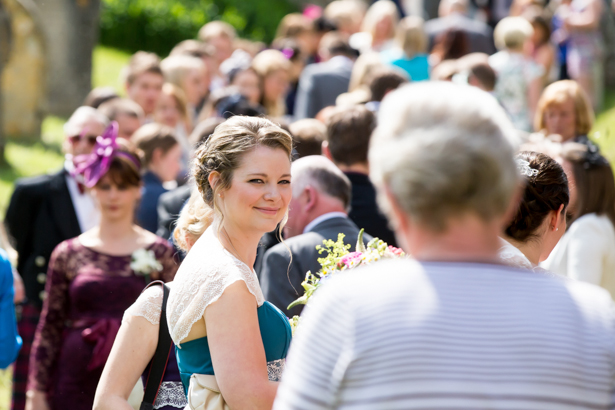 Bridesmaid in her teal Alfred Angelo dress | Confetti.co.uk