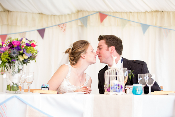 Bride and groom at the top table | Rustic wedding decor | Confetti.co.uk