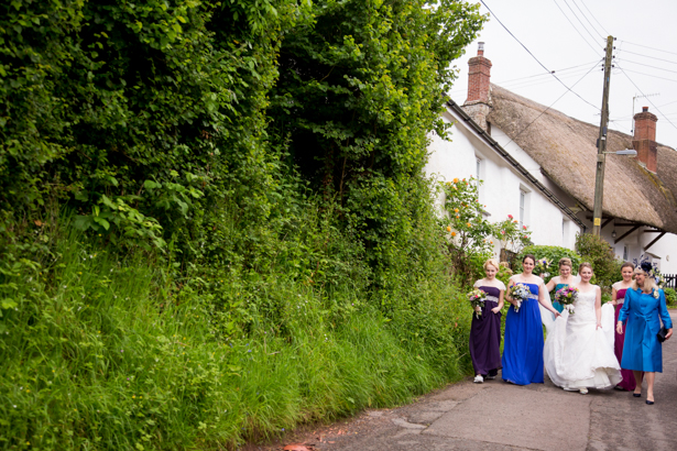 Bride and her bridesmaids on their way to the church | Confetti.co.uk