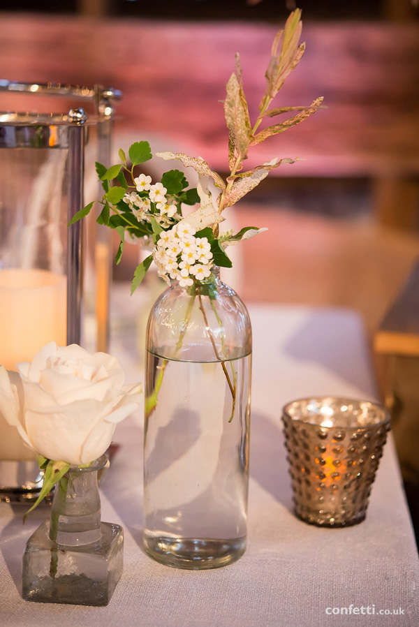 Rustic glass bottle table setting | Wildflower and vintage centrepieces | Confetti.co.uk 