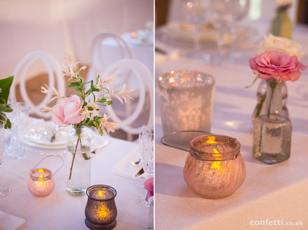 Rustic themed wedding decor | vintage candle holders and clear glass bottle centrepiece | Barn Wedding | Confetti.co.uk   