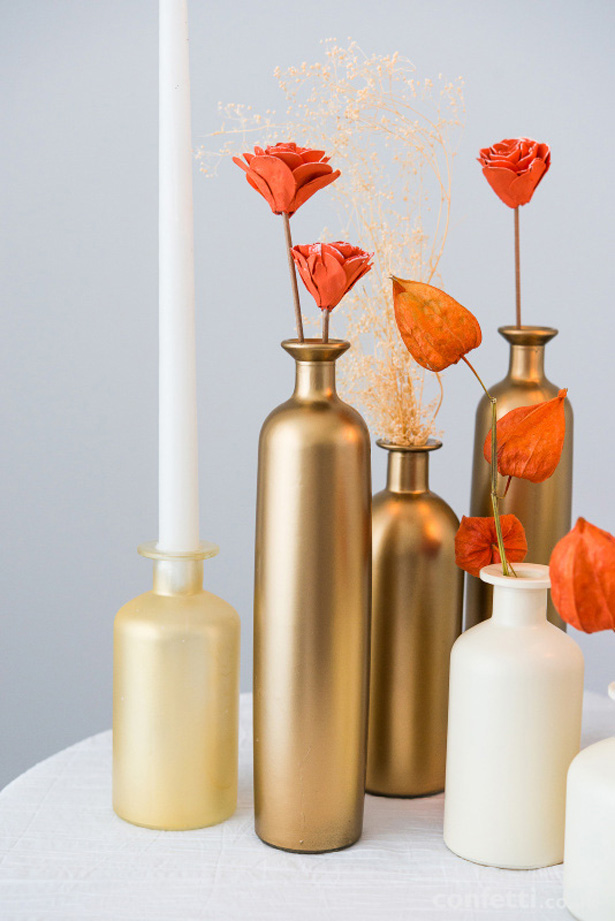 Autumnal gold bottles and flowers | Confetti.co.uk