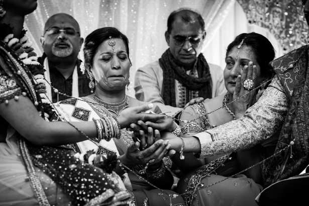 Emotional wedding guest during the ceremony | Traditional Hindu wedding customs | Confetti.co.uk