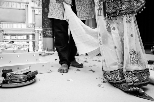 Bride and groom walking round the sacred fire | Traditional Hindu wedding customs | Confetti.co.uk