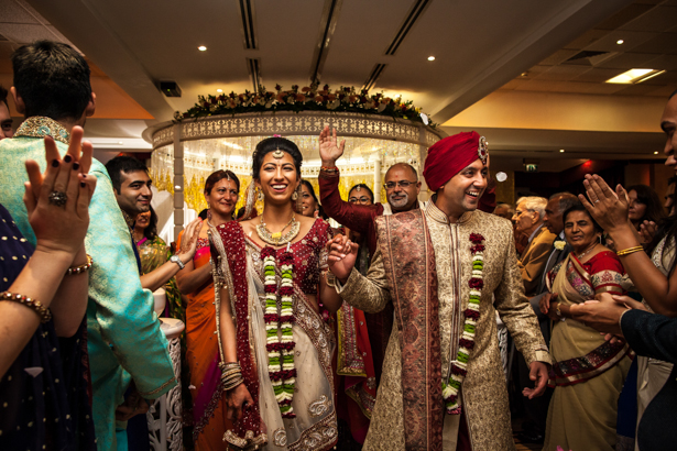 The newlyweds leaving the mandap| Traditional Hindu wedding | Confetti.co.uk