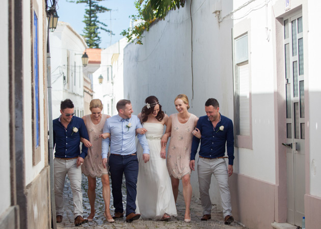 How to Choose Your Bridesmaids | Bride and groom with their bridesmaids and groomsmen in Portugal | Confetti.co.uk 