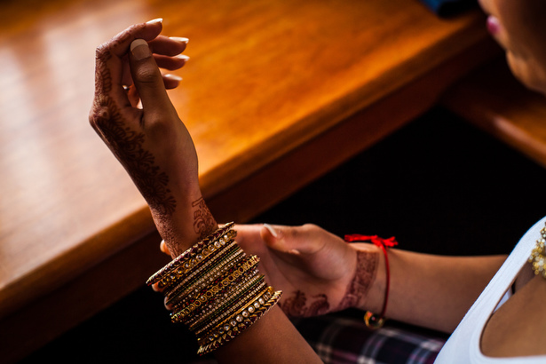 Indian bridal henna, mehndi with red and gold bangles | Confetti.co.uk