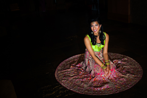 The bride in a beautiful green and pink Indian wedding outfit  by Kabilan Ravira | Confetti.co.uk