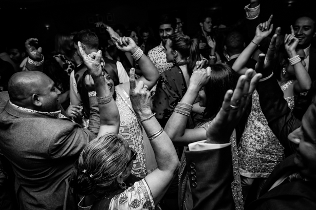 Wedding guests dancing at the reception | Confetti.co.uk