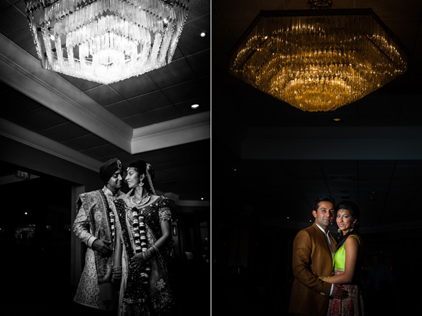 The bride and groom in traditional Indian wedding outfits  under a beautiful chandelier captured by Kabilan Ravira | Confetti.co.uk