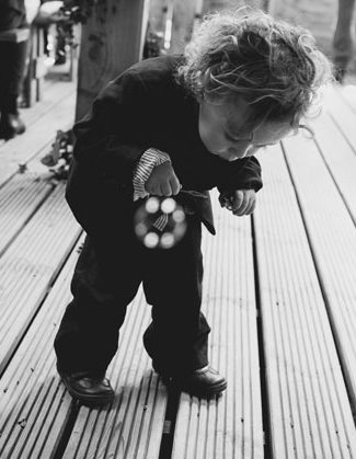 Page Boy Blowing Bubbles at Wedding