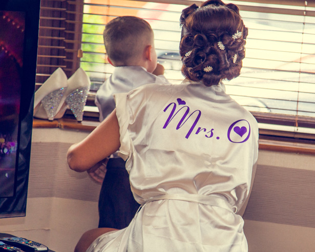 Bride wearing a white personalised dressing gown | Silver vintage bridal head pieces | Becki and Rob’s Real Wedding By Jenny Martin Photography | Confetti.co.uk