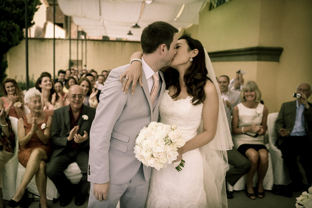 The first kiss as husband and wife | Morgan and James Real Wedding By Infinity Weddings | Confetti.co.uk