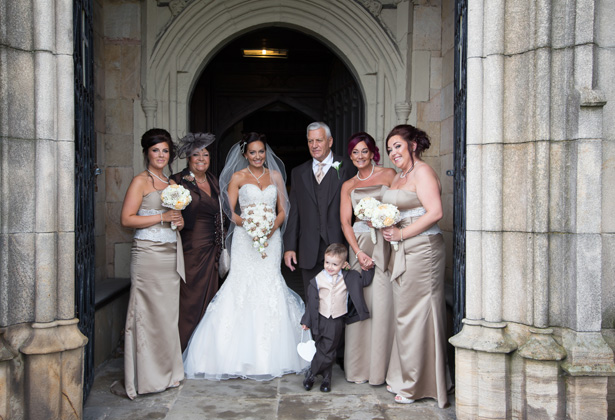 Bride with her bridal party outside the St. Michael and all Angels’ church in Ashton | Becki and Rob’s Real Wedding By Jenny Martin Photography | Confetti.co.uk