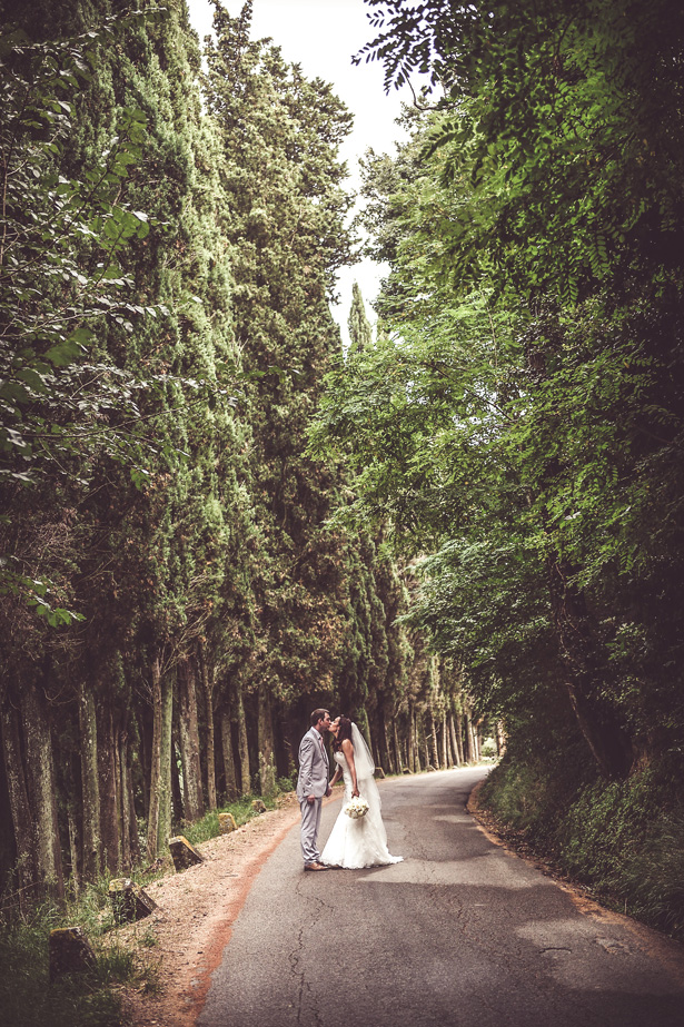 Official wedding shot in the forest | Bride and groom kissing | Morgan and James Real Wedding By Infinity Weddings | Confetti.co.uk