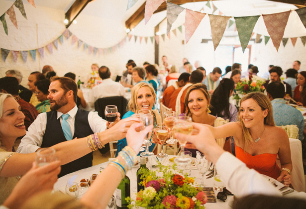 Wedding guest toasting the marriage | Francesca & Arun's Fusion Real Wedding | Confetti.co.uk  