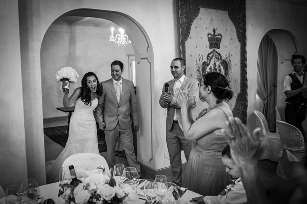 Bride and groom entering their wedding reception at Villa Bucciano , Tuscany | Morgan and James Real Wedding By Infinity Weddings | Confetti.co.uk