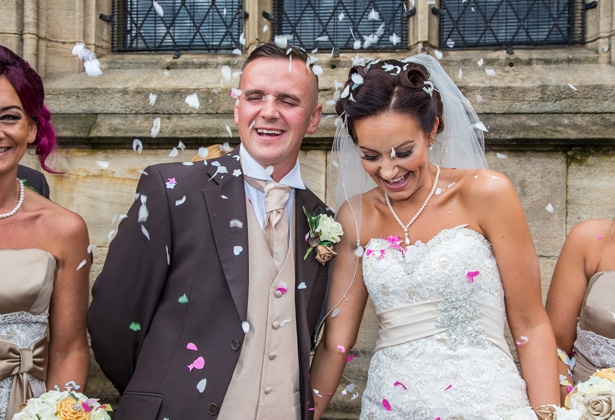 Guests throwing confetti over the bride and groom to celebrate the union | Becki and Rob’s Real Wedding By Jenny Martin Photography | Confetti.co.uk