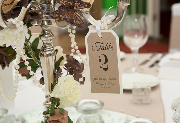 Vintage tag table number | Silver candelabra with brown and white deco| Becki and Rob’s Real Wedding By Jenny Martin Photography | Confetti.co.uk