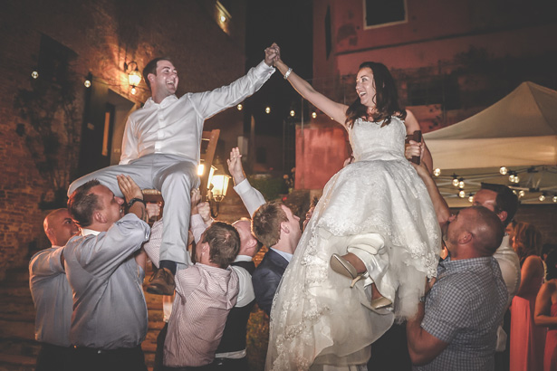 Wedding guests lifting the bride and groom | Morgan and James Real Wedding By Infinity Weddings | Confetti.co.uk